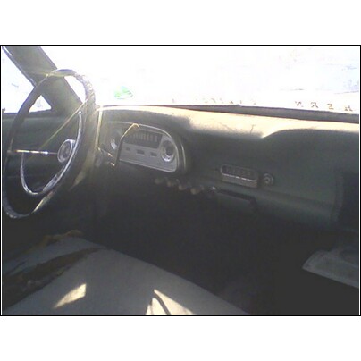 1972 Ford Ranchero - The interior of a 1972 Ford Ranchero shows a cracked steering wheel and a worn dashboard.