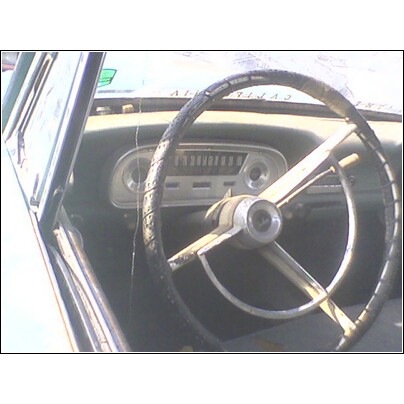 1972 Ford Ranchero - The interior of a 1972 Ford Ranchero shows a cracked steering wheel and the dashboard with visible gauges.