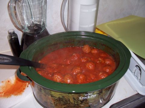 2004 Aston Martin Virage - Meatballs cooking in a Rival Crock-Pot slow cooker with a blender in the background.