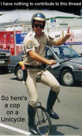 1998 Ford Crown Victoria - A police officer is humorously riding a unicycle while giving a thumbs up.