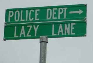 1998 Ford Crown Victoria - Street signs indicate directions for Police Dept and Lazy Lane.