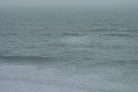 1993 Ford Bronco - Ocean waves on a foggy day with the Supermotors.net logo visible.