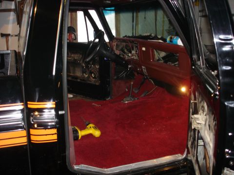 1979 Ford F-150 - Interior view of a 1979 Ford F-150 showing the dashboard removed and red carpet.
