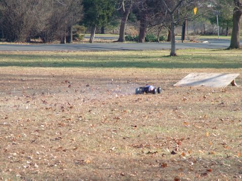1994 Ford Bronco - A radio-controlled car is seen on a grassy field with a ramp nearby.