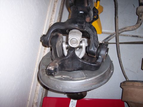 1996 Ford Bronco - This is a close-up view of a vehicle's front axle assembly, likely undergoing maintenance or modification.