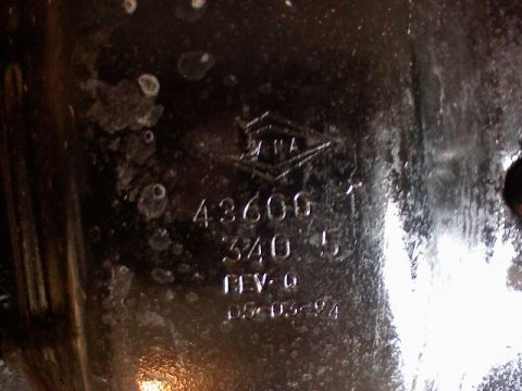 1996 Ford Bronco - A close-up view of a metal component shows embossed text and a date stamp of 05-03-94.