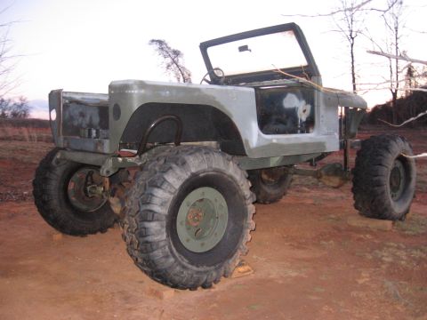 1980 Jeep CJ7 - This off-road vehicle appears to be a custom build with large tires and an unfinished body.