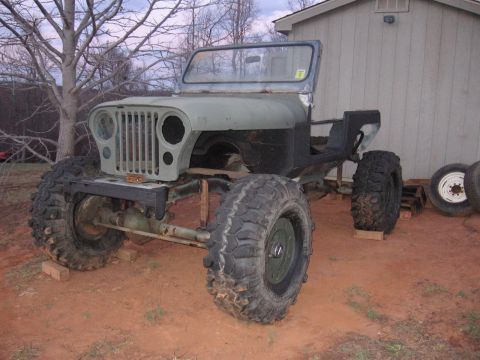 1980 Jeep CJ7 - This Jeep appears to be a project vehicle, possibly a CJ series, in a state of disrepair or modification.