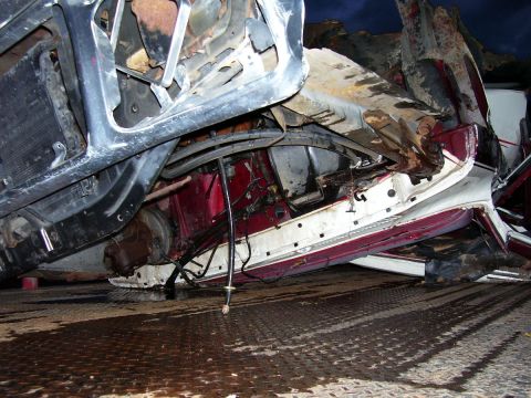1979 Ford Pickup - This severely damaged vehicle chassis shows extensive structural compromise.