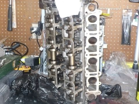 1996 Ford Mustang - Engine cylinder head assembly with visible camshafts and valves.