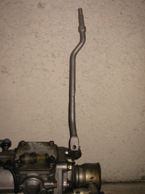 1985 Subaru Brat - This photo shows a gear shifter mechanism attached to a vehicle transmission. The year is not discernible.