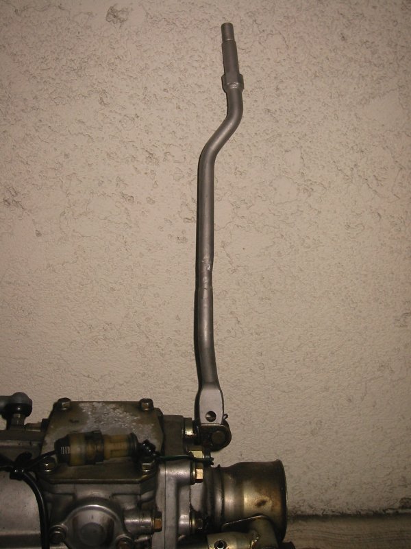 Close-up of a car's gear shifter and part of the transmission assembly