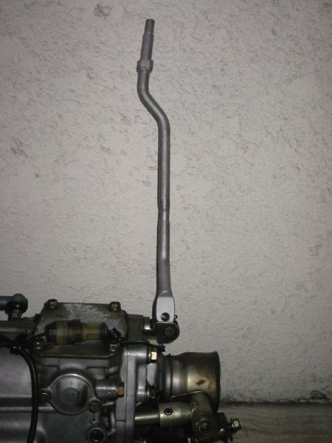 1985 Subaru Brat - Close-up of a gear shifter and transmission assembly, likely for a vehicle conversion project.