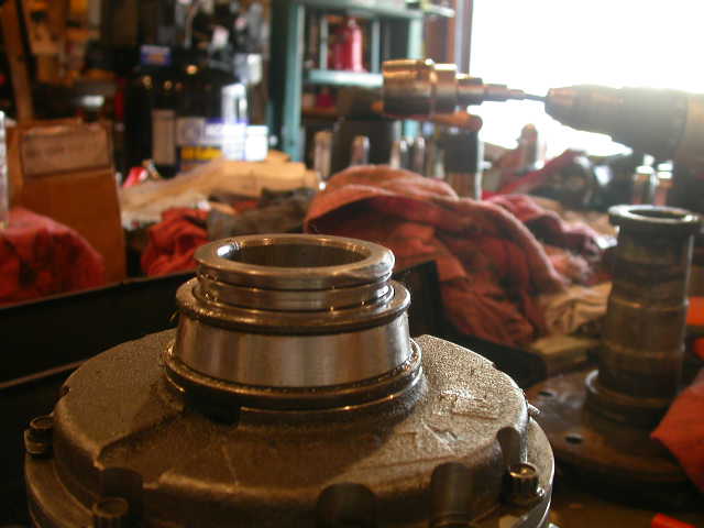 Bearing or hub component clamped in a vise in a workshop