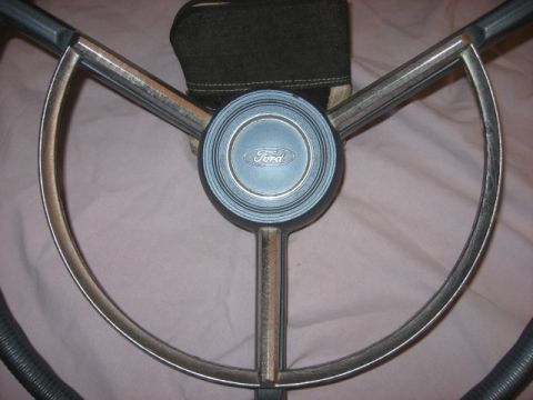 1972 Ford F-100 - Ford steering wheel with blue horn button and chrome trim, likely from a 1970s truck.