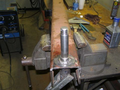 1993 Ford Bronco - Workshop scene shows a metal part being worked on, with tools and supplies nearby.