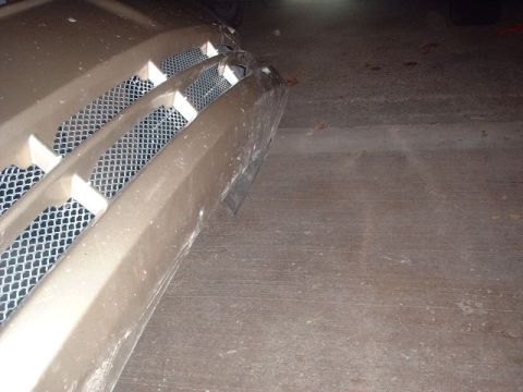 2000 Ford Taurus - Close-up of a car's front grille, showing its textured surface and design.
