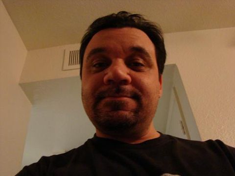 1989 Ford Bronco - A man is shown in a close-up selfie, with a wall and vent visible in the background.