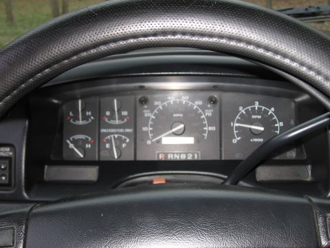 1967 Ford Mustang - The dashboard of a truck shows the speedometer, tachometer, fuel gauge, and oil pressure gauge.