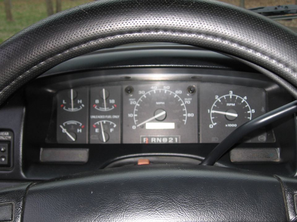Dashboard gauges and steering wheel of a truck. Speedometer reads about 40 mph