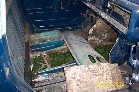 1978 Ford Bronco - Interior view of a heavily rusted vehicle, possibly an International Scout 800, showing significant disrepair.