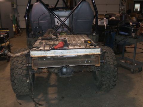 1995 Ford Bronco - This vehicle appears to be undergoing a rebuild, with its rear section disassembled and tools present.