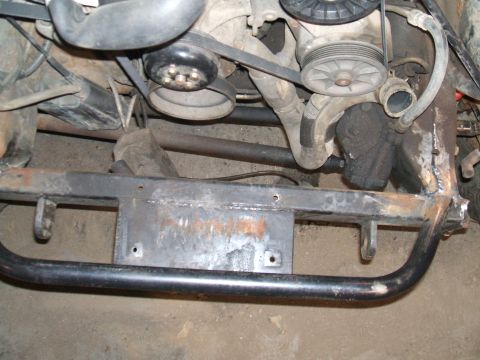 1995 Ford Bronco - Engine and frame components, possibly during a rebuild or repair process.