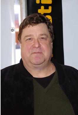 1989 Ford Bronco - Actor John Goodman poses for a photo, possibly at an event.