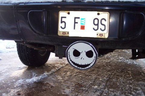 2007 Dodge Durango - A vehicle's rear bumper displays a license plate and a Jack Skellington hitch cover, with snow on the ground.