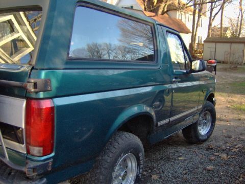 1996 Ford Bronco - This 1996 Ford Bronco is shown from a 3/4 front angle, highlighting its distinctive body style.