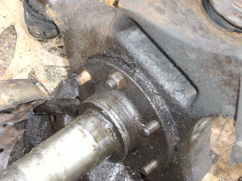 1992 Ford F-150 - First, take off all 6 nuts holding the spindle on the knuckle. This one didnt want to come off.