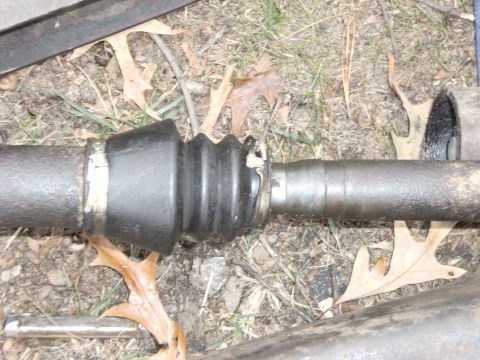 1992 Ford F-150 - On the passenger side shaft, remove the Keystone clamp in the slip joint boot.