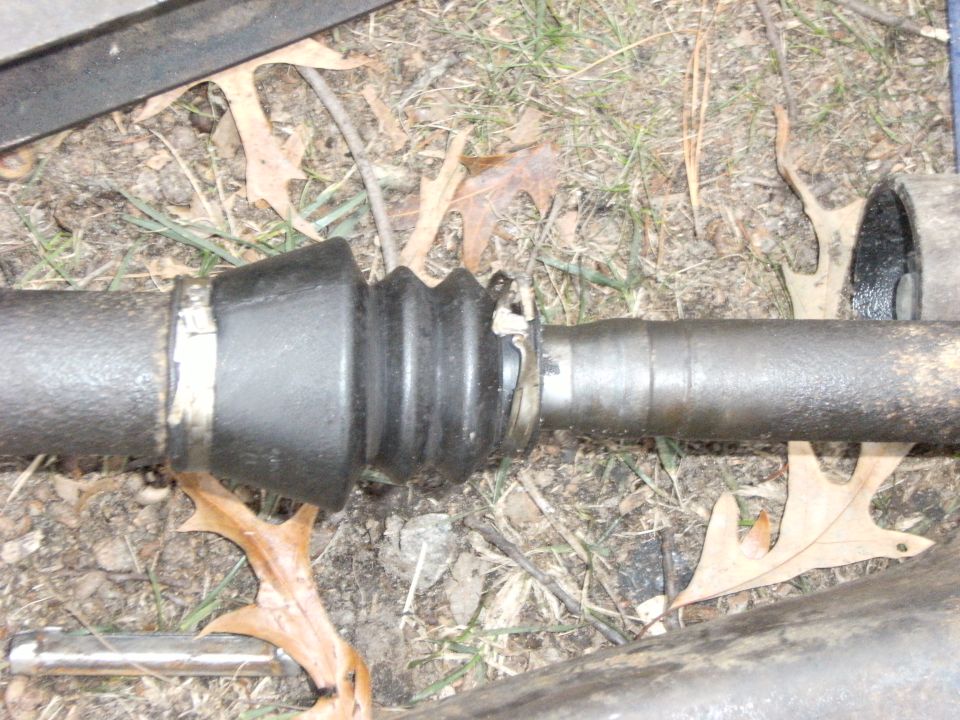 On the passenger side shaft, remove the Keystone clamp in the slip joint boot.