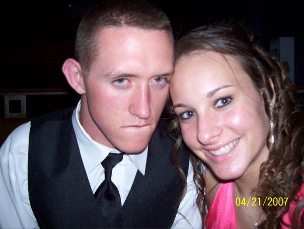 Couple posing for a photo, with a date stamp of 04/21/2007 visible