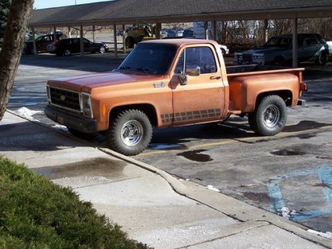 1979 Chevrolet C/K Pickup - This 1979 Chevrolet C/K Pickup truck is seen from a three-quarter front angle in a parking lot.
