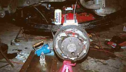 1979 Ford Bronco - New spring installed. Coors is one of my personal mechanics.