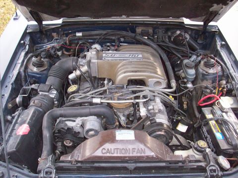 1989 Ford Mustang - Engine bay of a Ford Mustang, showing the 5.0 HO engine and related components.