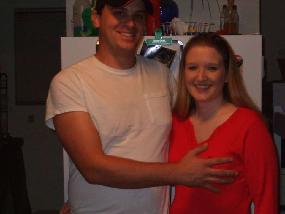 guy with hand on girl's chest, both smiling