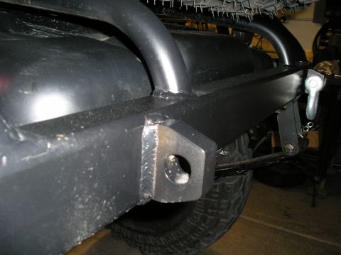 1986 Toyota Hilux - Close-up view of a custom rear bumper and tow hitch assembly on a vehicle.