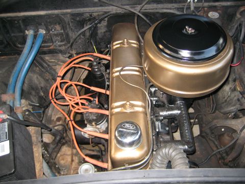 1953 Ford Mainline - Close-up of a 1953 Ford engine bay, showing the valve covers, air cleaner, and spark plug wires.