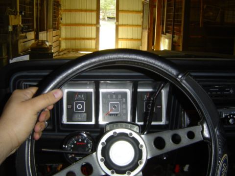 1979 Ford Bronco - Interior view of a classic vehicle's dashboard, a steering wheel and various gauges.