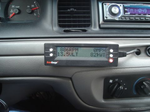 2000 Ford Crown Victoria - ScanGauge II unit installed in the interior of a 2000 Ford Crown Victoria, displaying various vehicle metrics.