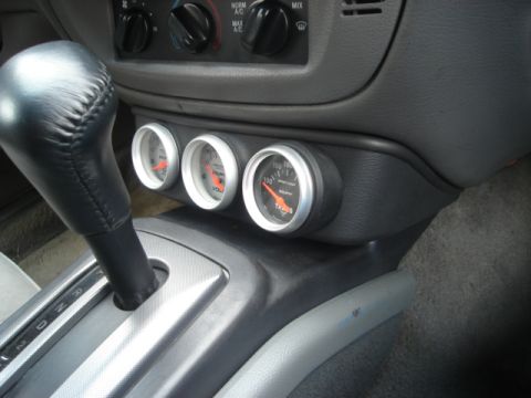 2000 Ford Crown Victoria - Aftermarket gauges are installed in the center console of this vehicle.