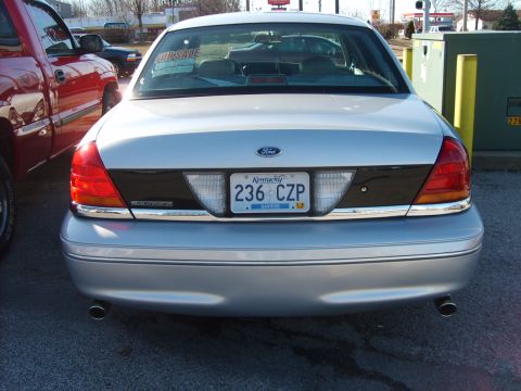 1993 Ford Crown Victoria - Rear view of a silver 2001 Ford Crown Victoria, showing its taillights, trunk, and license plate.