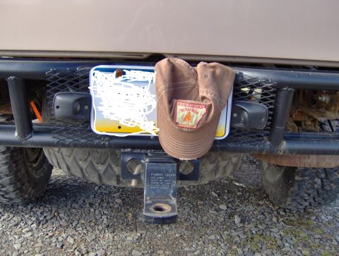 1978 Ford Bronco - A brown Arkansas hat rests on the rear bumper of a vehicle, obscuring the license plate.