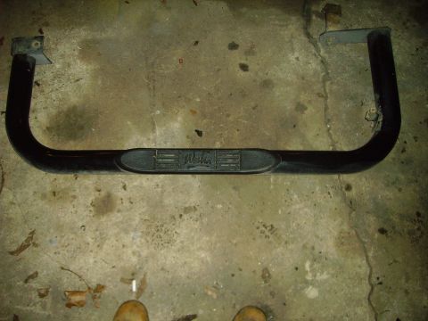1991 Ford Bronco - A black step bar with the Westin logo is shown on a concrete floor.