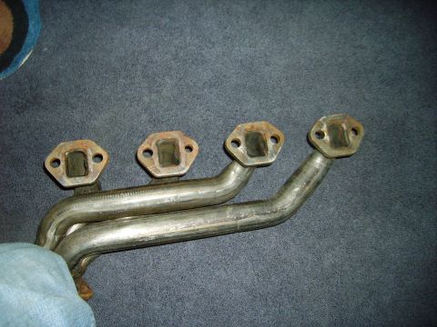 1991 Ford Bronco - Exhaust manifold with four ports, likely from an older vehicle.