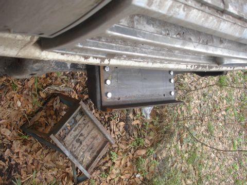 1989 Ford Bronco - A custom winch mount bracket is bolted to the underside of a vehicle frame.