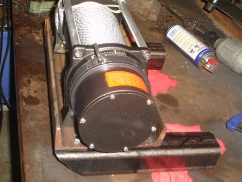 1989 Ford Bronco - A winch mount is shown with the 'CLUTCH OUT' label visible on the winch drum.