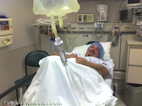1968 Ford Mustang - A patient lies in a hospital bed, receiving an IV drip, with medical equipment visible in the background.